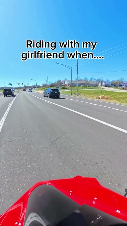 Frame at 2 seconds: Moving road POV carries the unfinished setup, 'Riding with my girlfriend when....'