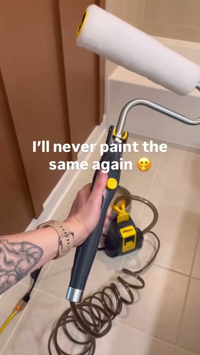 Frame at 3 seconds: The creator holds up the roller handle, with its coiled hose and pump visible below, before cutting to application.