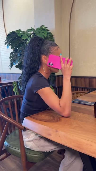 Frame at 3 seconds: A wider side view maintains the phone-at-face pose.