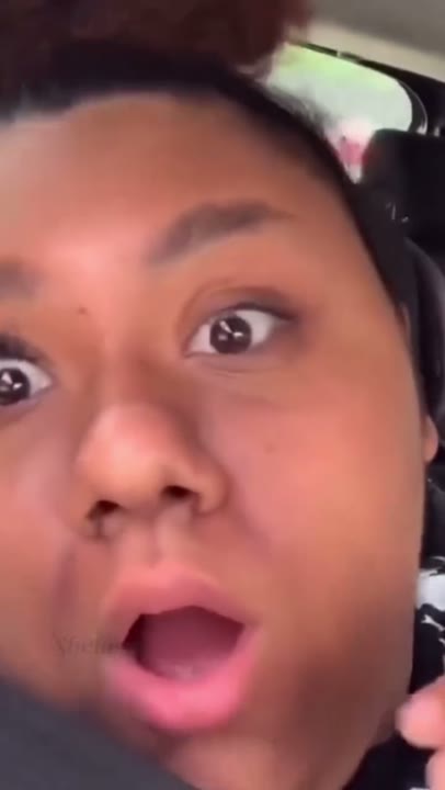 Frame at 1 seconds: The creator opens their eyes and mouth wide, then laughs, emphasizing one heavily lashed eye beside an apparently…