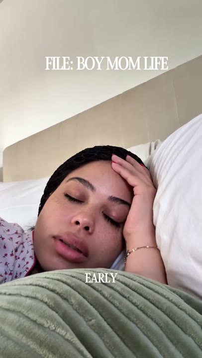 Frame at 1 seconds: The creator rests with eyes closed beneath 'FILE: BOY MOM LIFE' while complaining that it is early; kiwi appears at…