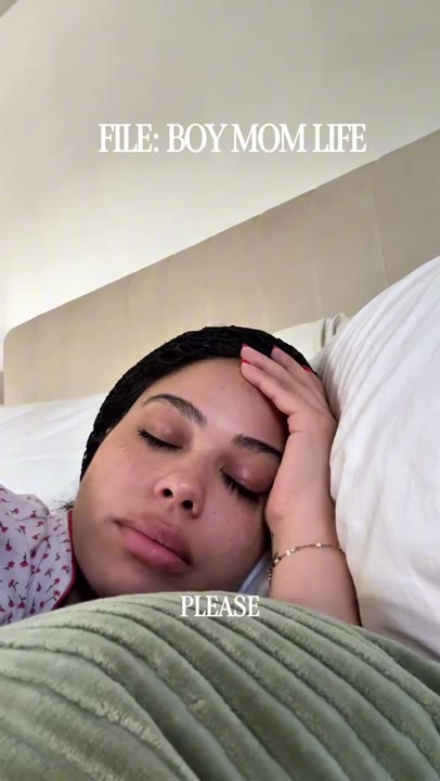 Frame at 2 seconds: The creator rests with eyes closed beneath 'FILE: BOY MOM LIFE' while complaining that it is early; kiwi appears at…