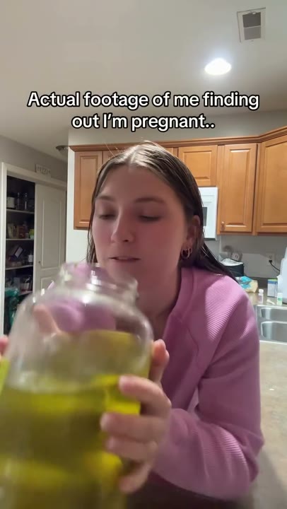 Frame at 3 seconds: The creator lifts the oversized jar and drinks directly from it.