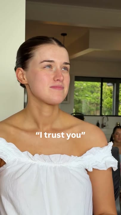 Frame at 2 seconds: The creator smiles and briefly waves beneath “I trust you.”