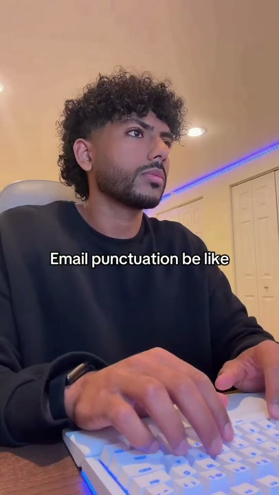 Frame at 2 seconds: The creator types beneath the persistent email-punctuation overlay.
