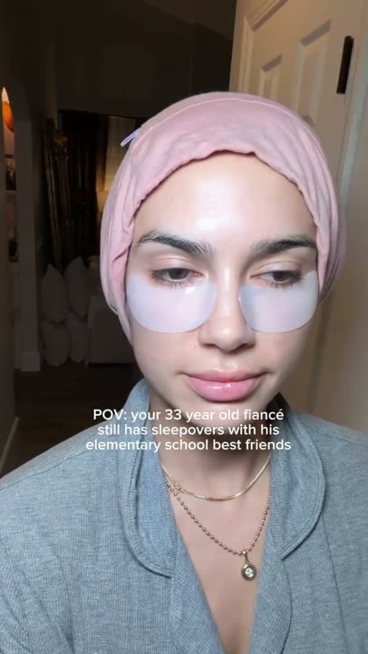 Frame at 2 seconds: Cut to the creator's understated selfie reaction in a hair wrap and eye patches.